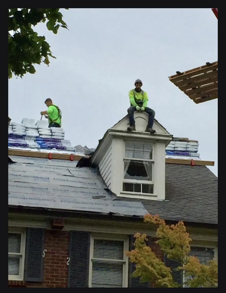 Mass and Mass crew working on a residential roof