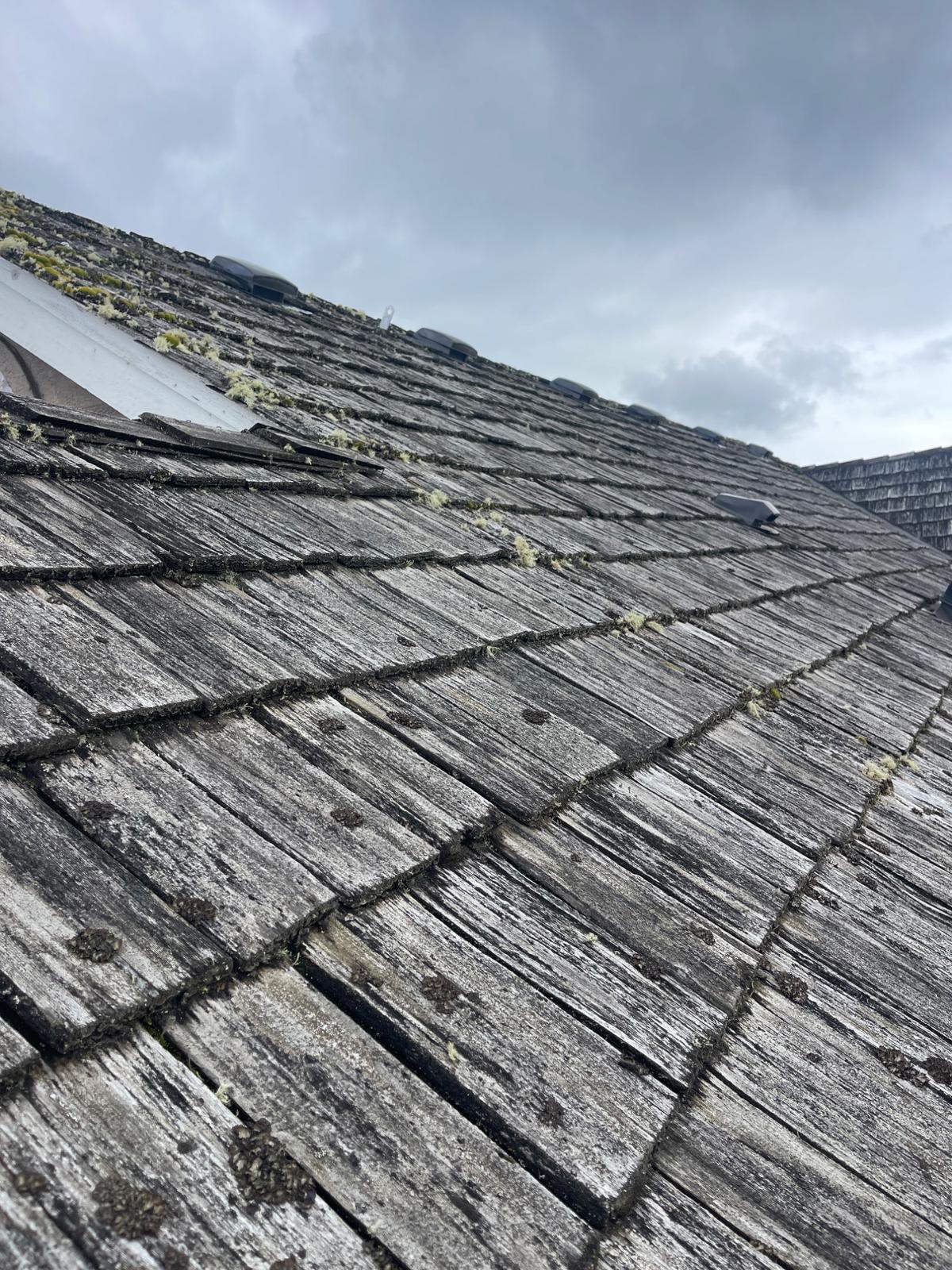 Roofing contractor working on an Edmonds home - Mass and Mass LLC